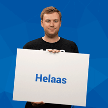 a man holding a sign that says helaas
