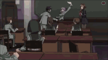 a girl with purple hair is holding a piece of paper and smiling in a classroom