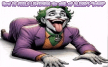 the joker is laying on the floor with his tongue out