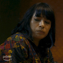 a woman is wearing a shirt that says prime on the front