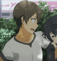 a man and a girl are standing next to each other in a park .