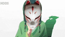 a person wearing a fox mask with ndds written on the bottom right