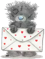 a teddy bear holding an envelope with red hearts on it