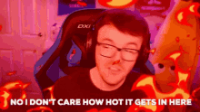 a man wearing headphones is sitting in a chair with flames coming out of his nose .