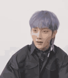 a young man with purple hair is wearing a black jacket and a black shirt .