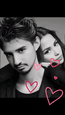a black and white photo of a man and woman with hearts drawn on them
