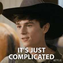 a man in a cowboy hat says it 's just complicated on a netflix ad