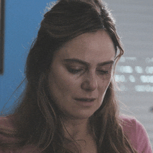 a woman with a black eye is crying