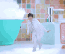 a man in a white coat is standing in front of a bottle that says ' soap ' on it