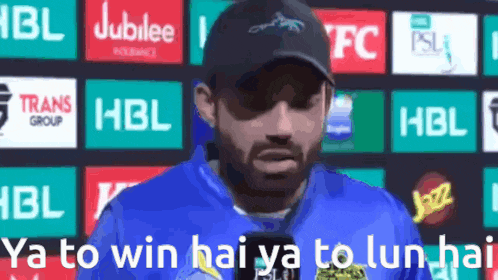 a man wearing sunglasses and a hat says ya to win