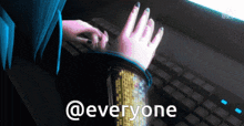 a person typing on a keyboard with the words @everyone written below them