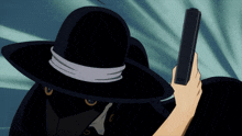 a man in a black hat is holding a black gun