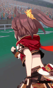 a girl in a red hooded jacket is running on a green field