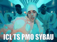 a man wearing a beanie and a jacket with the words icl ts pmo sybau on the bottom