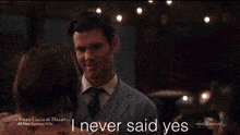 a man and woman are dancing in a hallmark movie