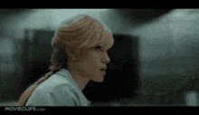 a close up of a woman 's face with movieclips.com on the bottom