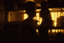 two people holding hands in front of a ferris wheel