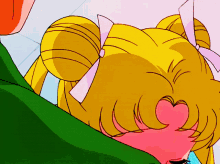 a close up of a girl 's face with a heart shaped nose