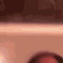 a close up of a person 's face with a blurred background
