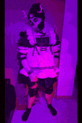 a person dressed in a maid outfit with a skull mask on their face