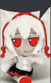 a stuffed doll with red eyes and white hair
