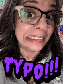 a woman wearing glasses is making a funny face with typo written in purple on her face