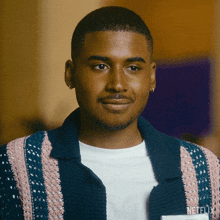 a man wearing a sweater with a netflix name tag
