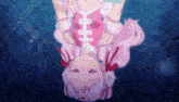 a girl with pink hair is upside down in the air