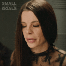 a woman with her eyes closed and the words small achievable goals on the bottom