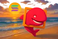 a red whale is holding a frame on a beach
