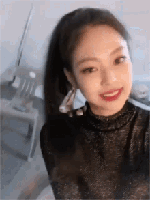a close up of a woman taking a picture of herself