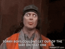 a man wearing a helmet and an orange vest is saying sorry boys couldnt get out of the way on that one