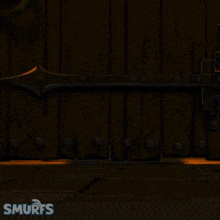 a smurf is kicking another smurf in a cartoon scene