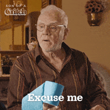 an elderly man holding a roll of toilet paper with the words excuse me below him
