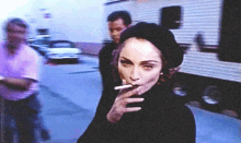 madonna smokes madonna smokes looking looking straight to camera madonna wins madonna smokes