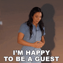 a woman says i 'm happy to be a guest while standing