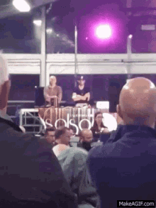 a group of people are watching a dj perform at a club called solso