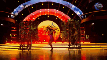 a woman is dancing on a stage with dancing brasil written on the bottom