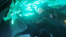 a man in a blue cape stands next to a dragon