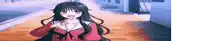 a girl with long black hair and blue eyes is standing on a sidewalk