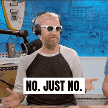 a man wearing headphones and sunglasses has a sign that says no just no