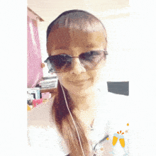 a woman wearing sunglasses and earbuds is smiling