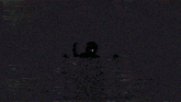 a silhouette of a person standing in front of a screen with white dots coming out of it