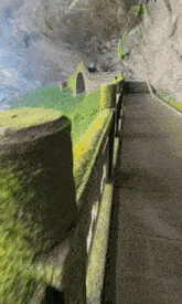a road going through a tunnel with a bridge going through it