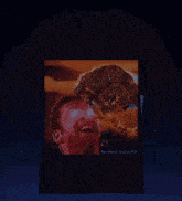 a black t-shirt with a picture of a man and a dog on it
