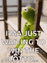 kermit the frog is sitting on a railing waiting to win the lottery .