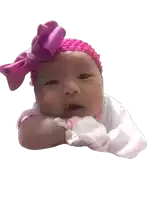 a baby wearing a pink headband with a pink bow