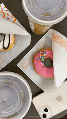 a donut is wrapped in a dunkin ' donuts paper