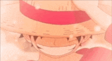 a close up of a person 's face with a straw hat on