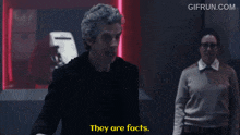 a man says they are facts while a woman looks on